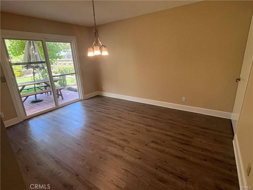 21681 Cabrosa Mission Viejo, CA 92691 - Photo 3 of 22 an empty room with wooden floor and windows