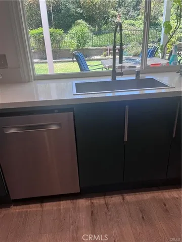 a view of a floor to ceiling window next to a yard