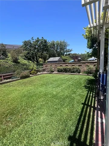 a view of a yard with an outdoor seating