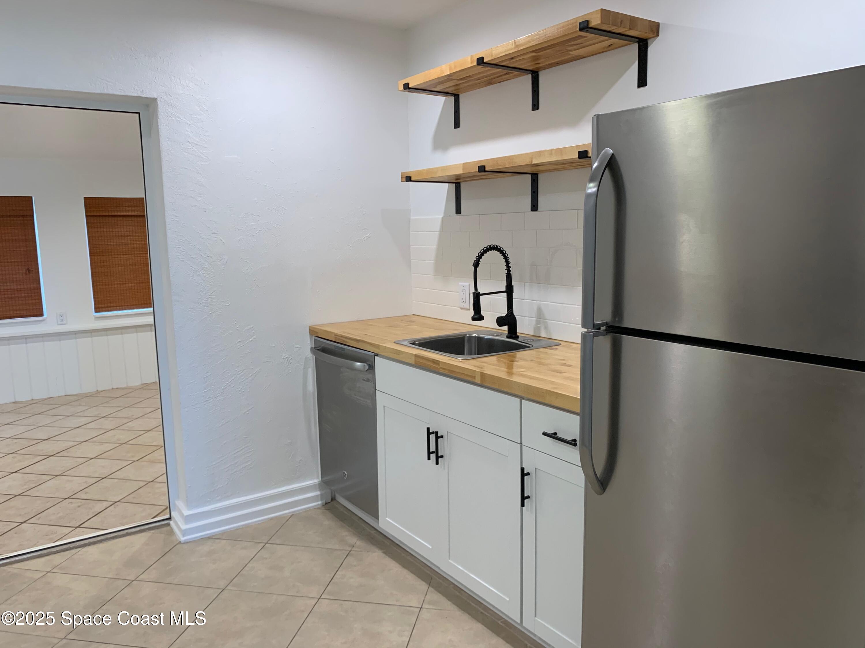 110 Del Flora Indialantic, FL 32903 - Photo 12 of 33 a bathroom with a sink and mirror