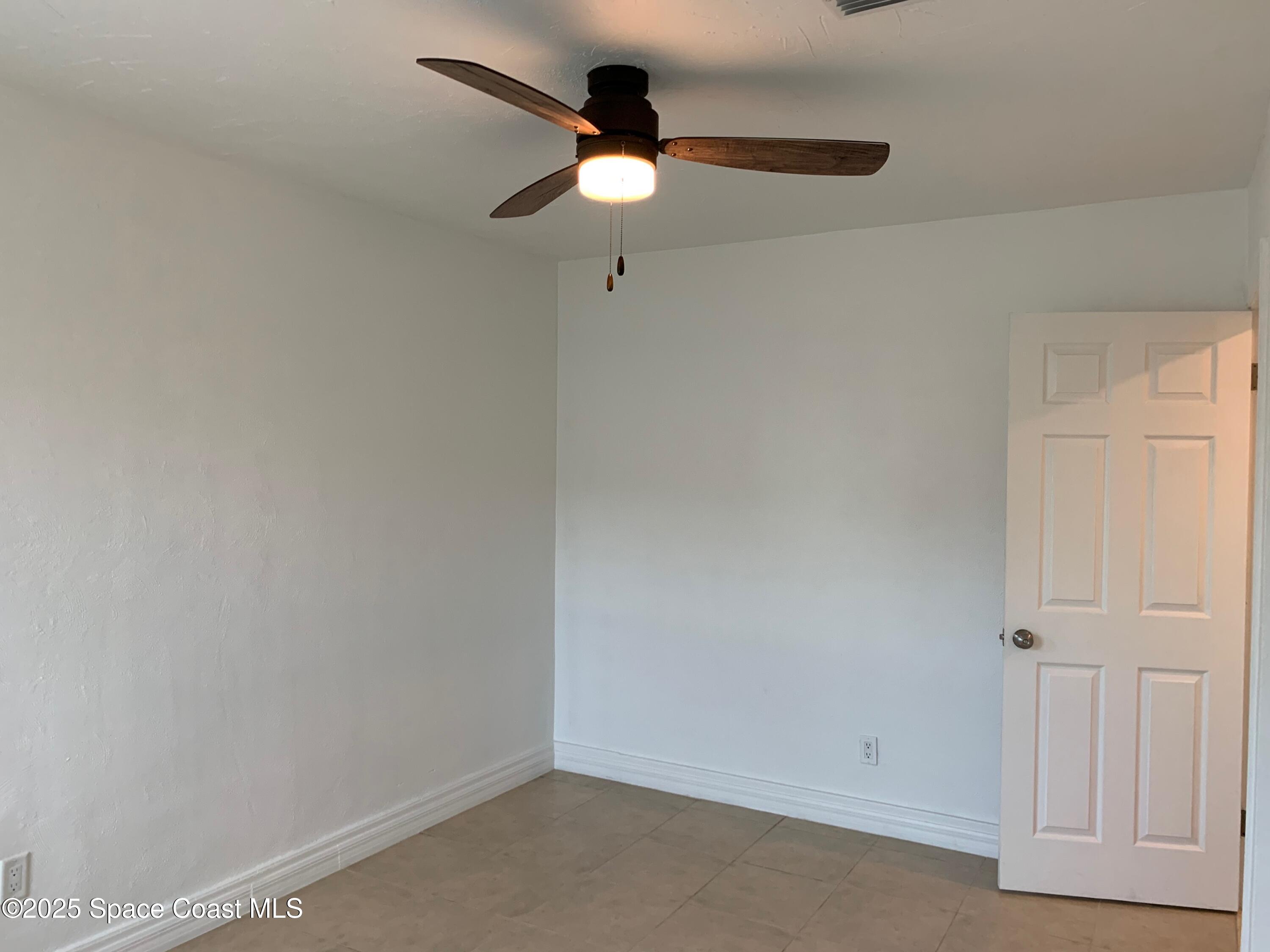 110 Del Flora Indialantic, FL 32903 - Photo 16 of 33 an empty room with a ceiling fan