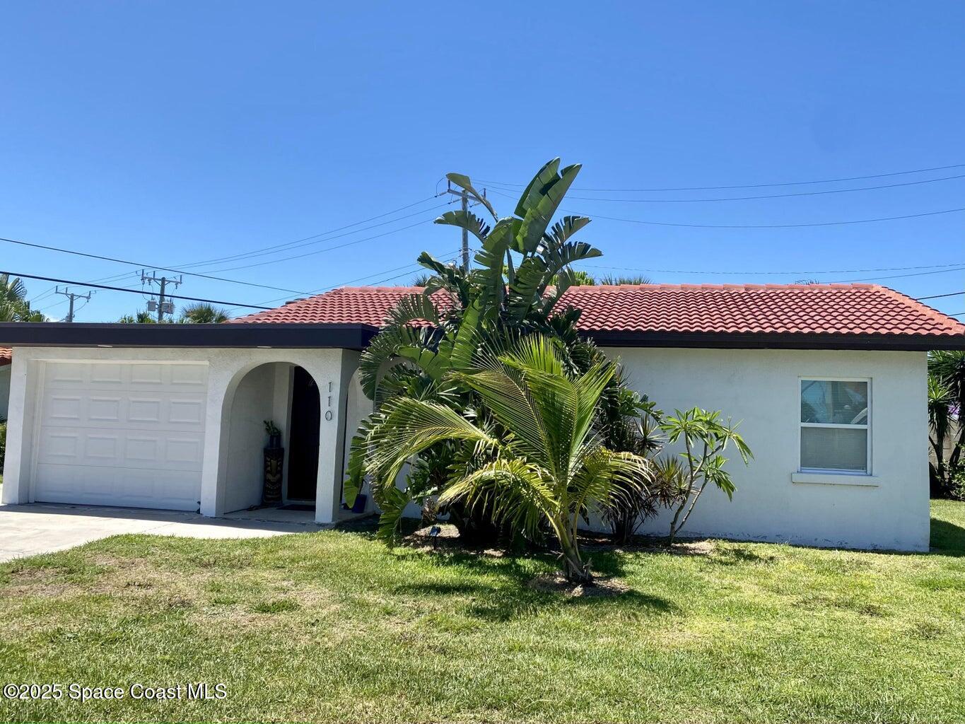 110 Del Flora Indialantic, FL 32903 - Photo 2 of 33 a front view of a house with a yard