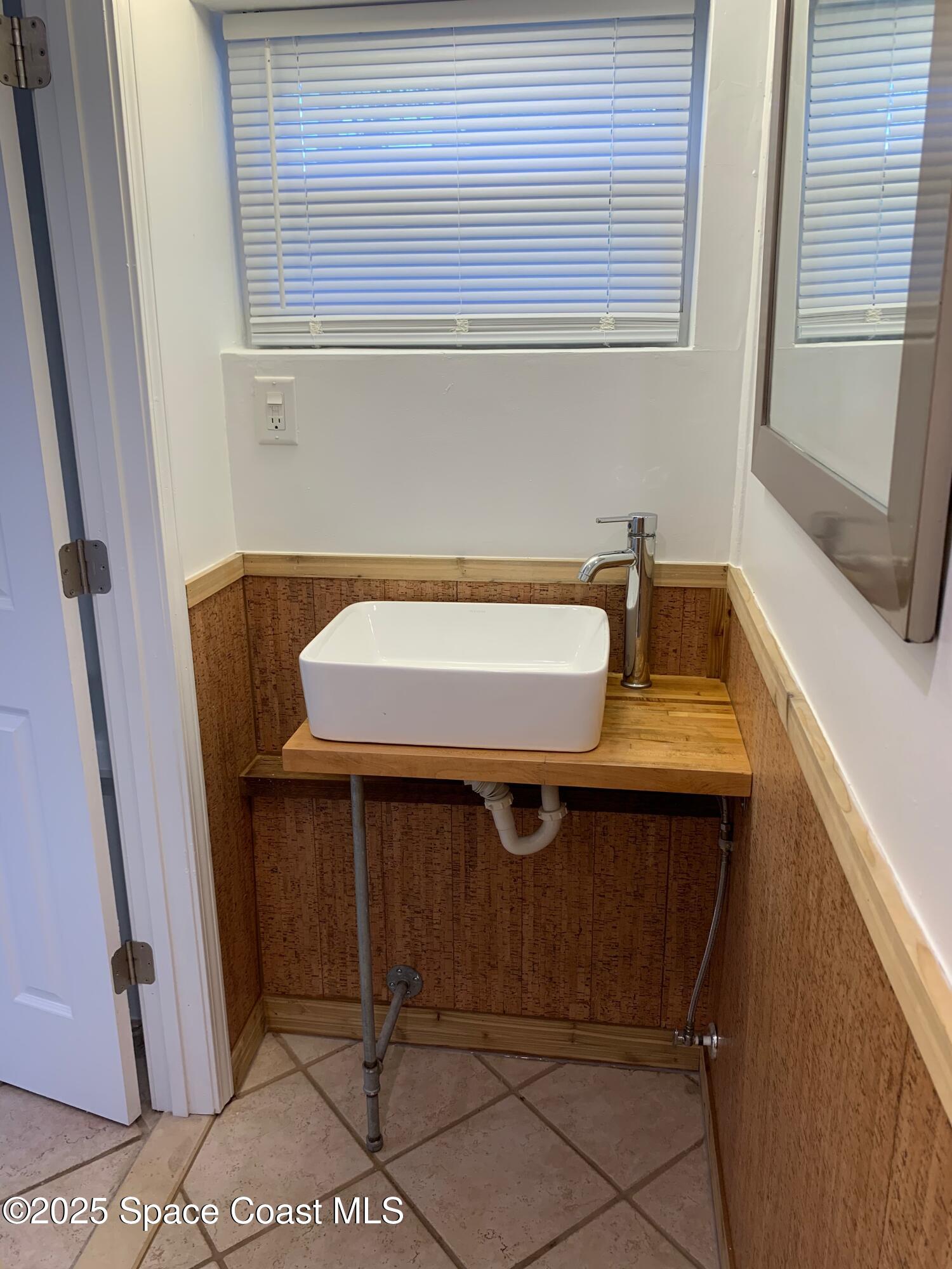 110 Del Flora Indialantic, FL 32903 - Photo 30 of 33 a bathroom with a sink and a window