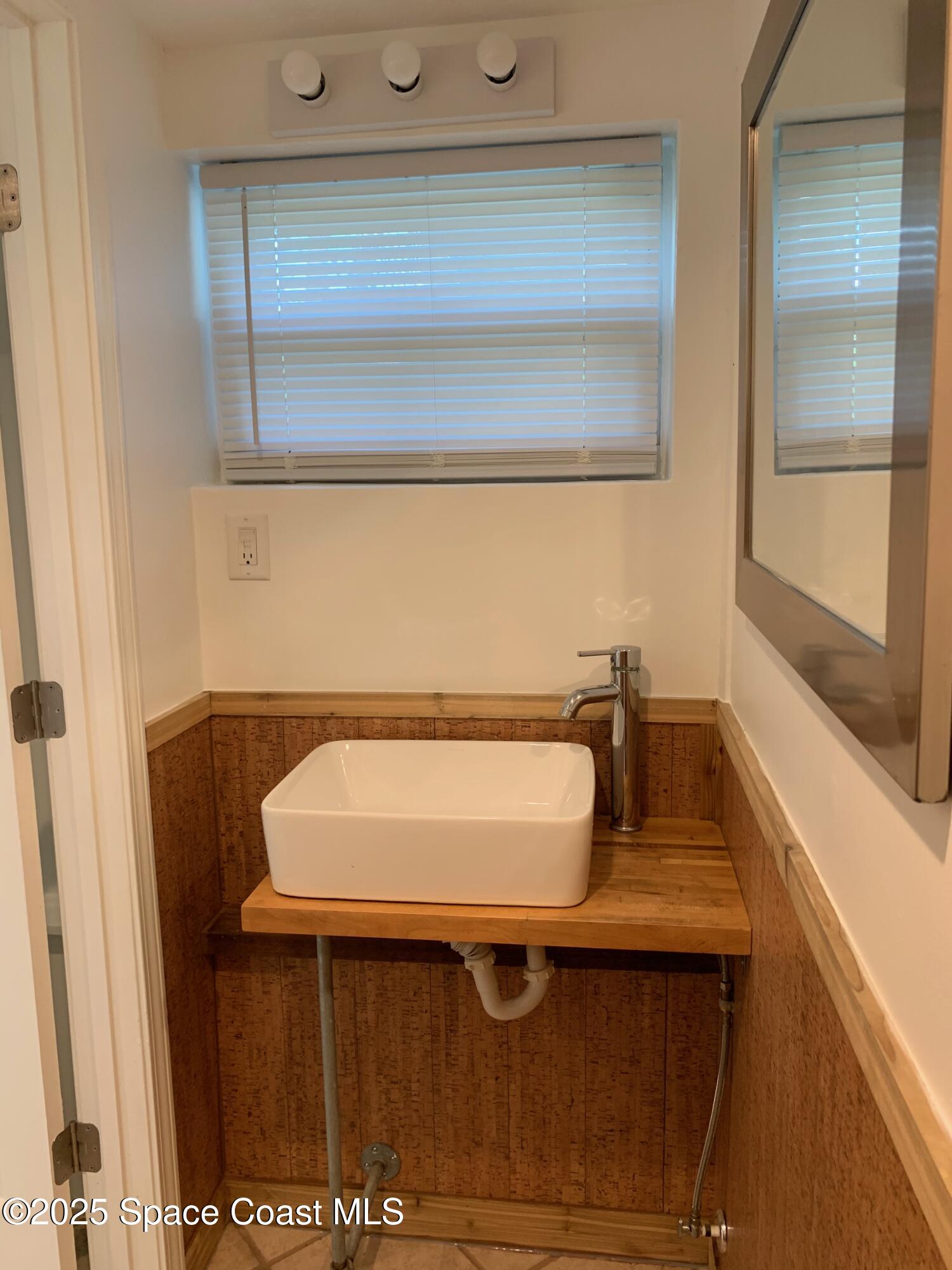 110 Del Flora Indialantic, FL 32903 - Photo 31 of 33 a bathroom with a sink and a mirror