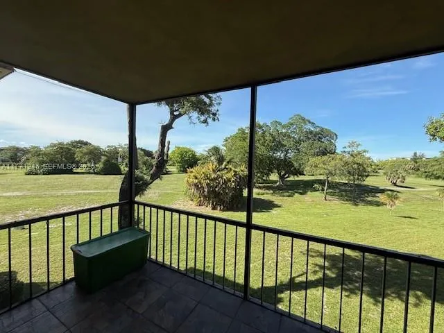a view of a street view from a balcony