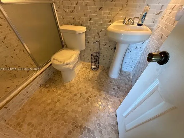 a bathroom with a sink and toilet