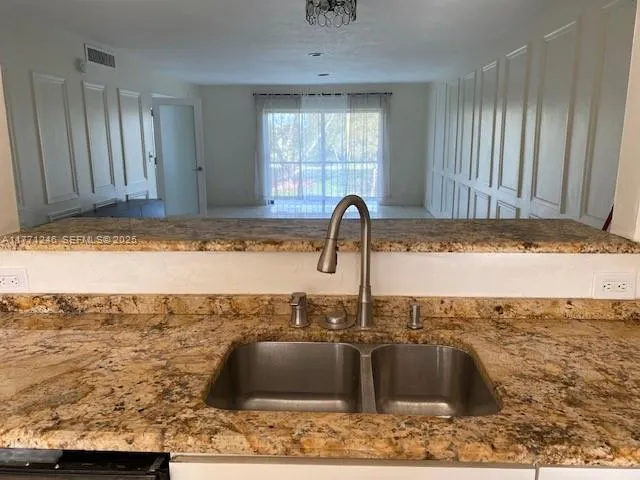 a kitchen with a sink and a window
