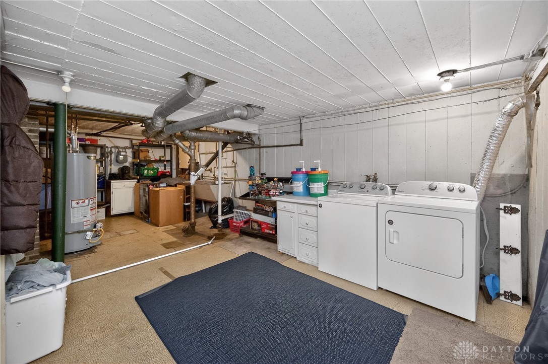 3301 Wildwood Road Middletown, OH 45042 - Photo 44 of 68 This practical utility room features essential appliances and ample space for all household tasks.