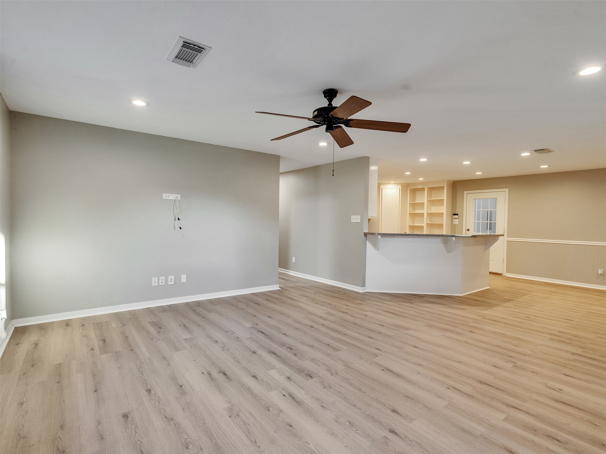 7301 Pearson Road Santa Fe, TX 77517 - Photo 16 of 46 a view of an empty room with a window and wooden floor