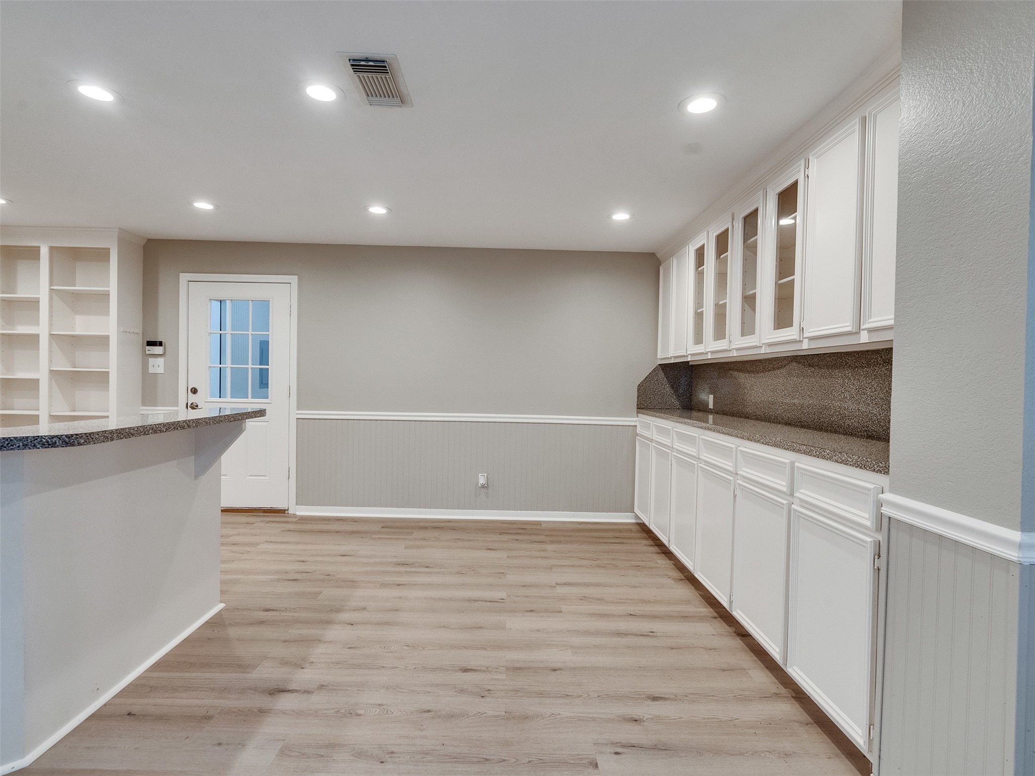 7301 Pearson Road Santa Fe, TX 77517 - Photo 17 of 46 a view of an empty room with wooden floor and a window