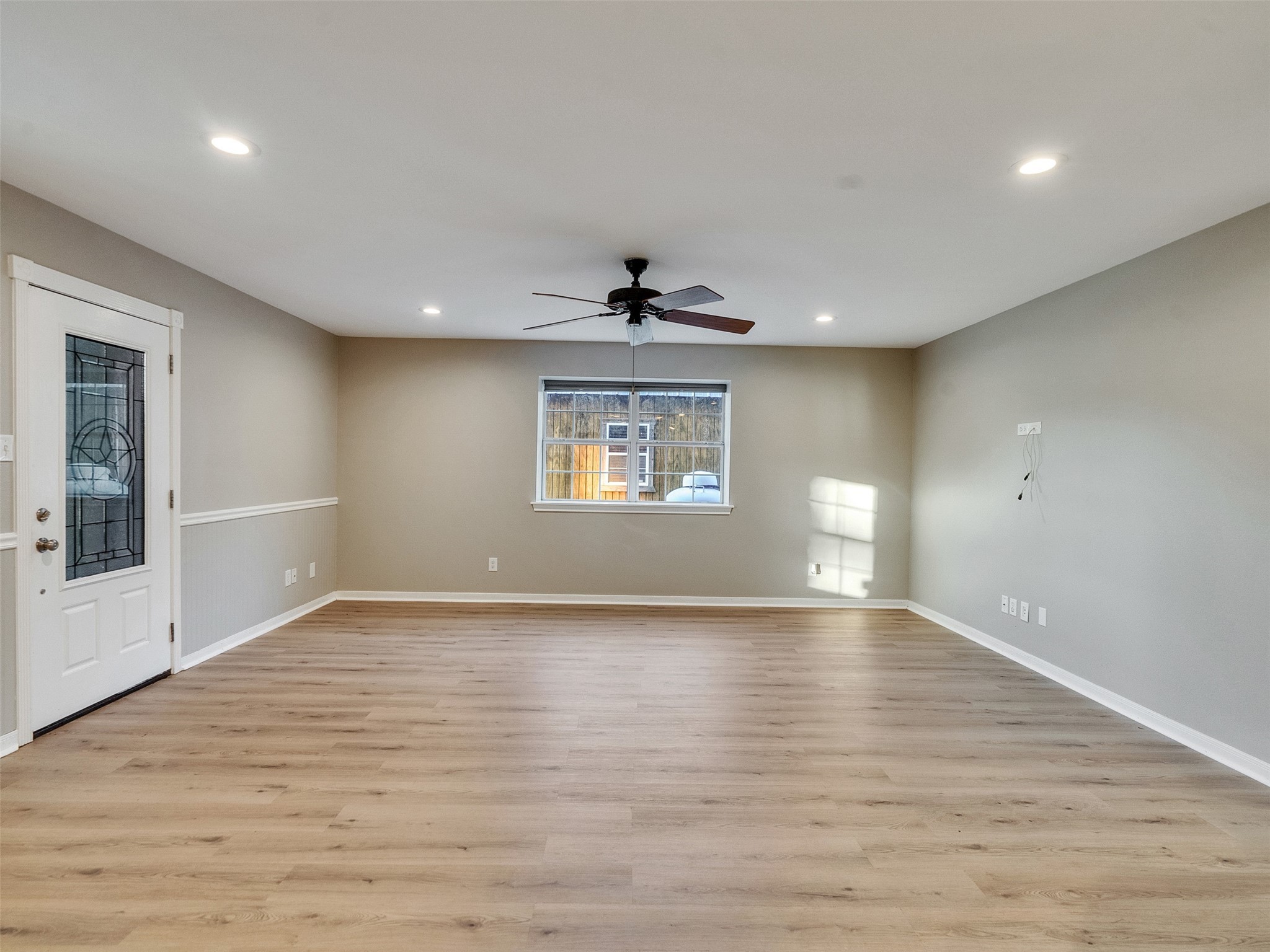 7301 Pearson Road Santa Fe, TX 77517 - Photo 21 of 46 a view of an empty room with a window and wooden floor