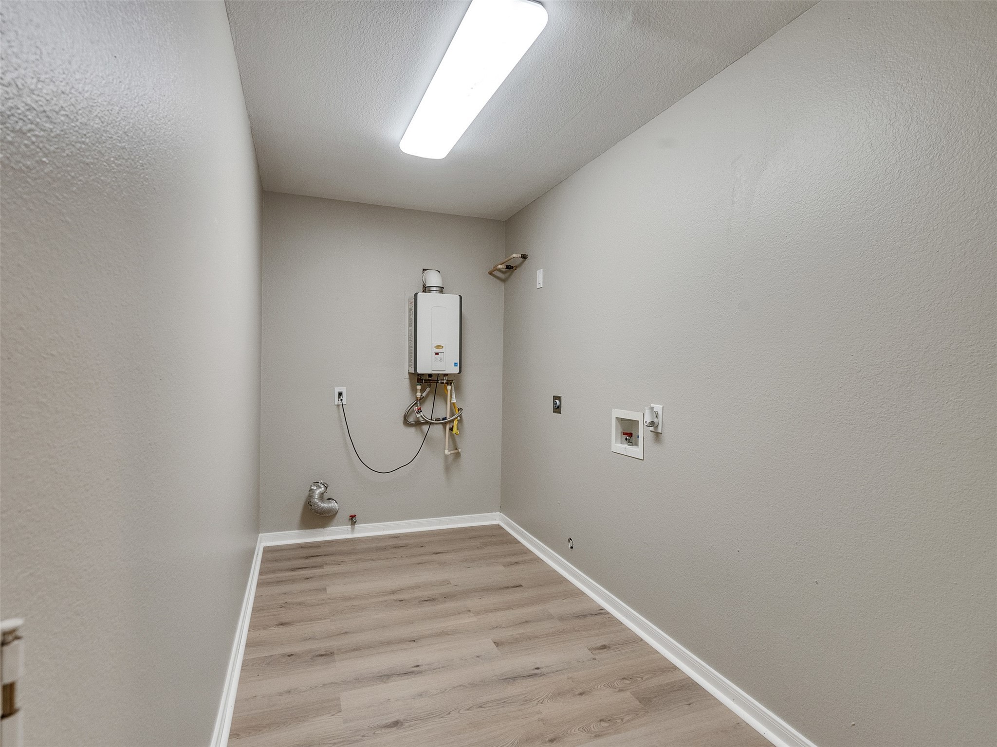 7301 Pearson Road Santa Fe, TX 77517 - Photo 22 of 46 a view of a room with wooden floor and white walls