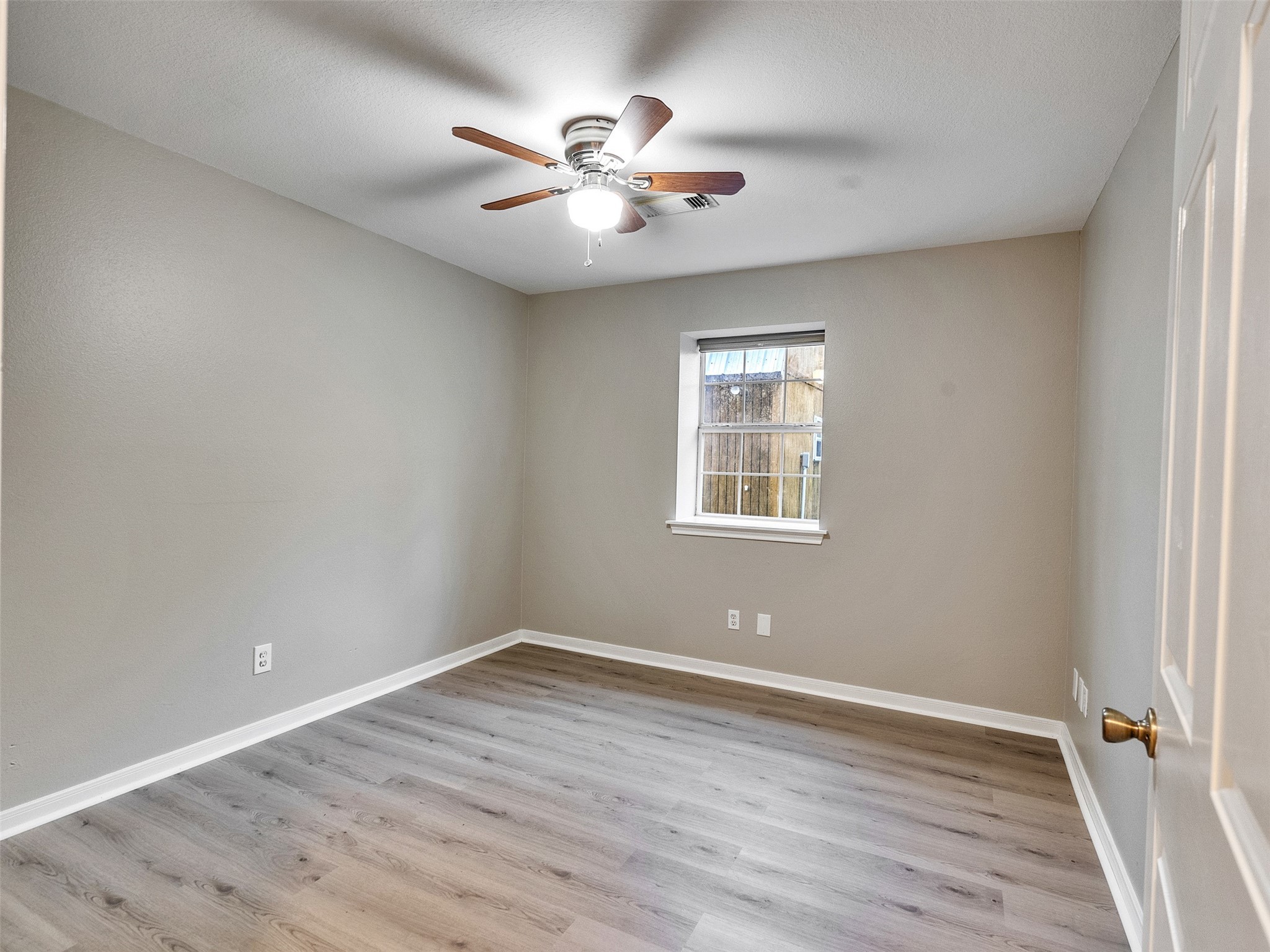 7301 Pearson Road Santa Fe, TX 77517 - Photo 23 of 46 wooden floor in an empty room with a window
