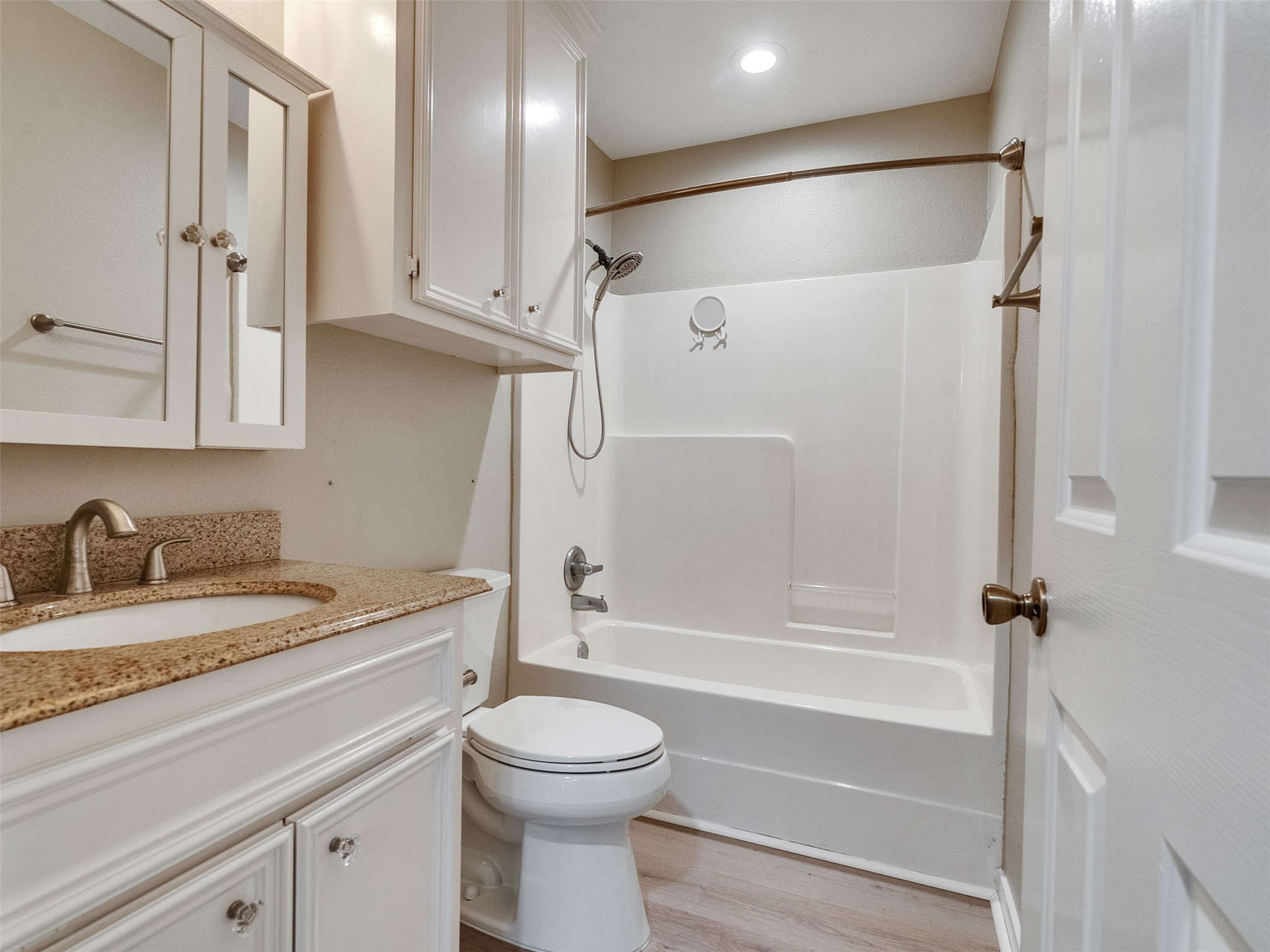 7301 Pearson Road Santa Fe, TX 77517 - Photo 24 of 46 a bathroom with a granite countertop sink toilet and shower