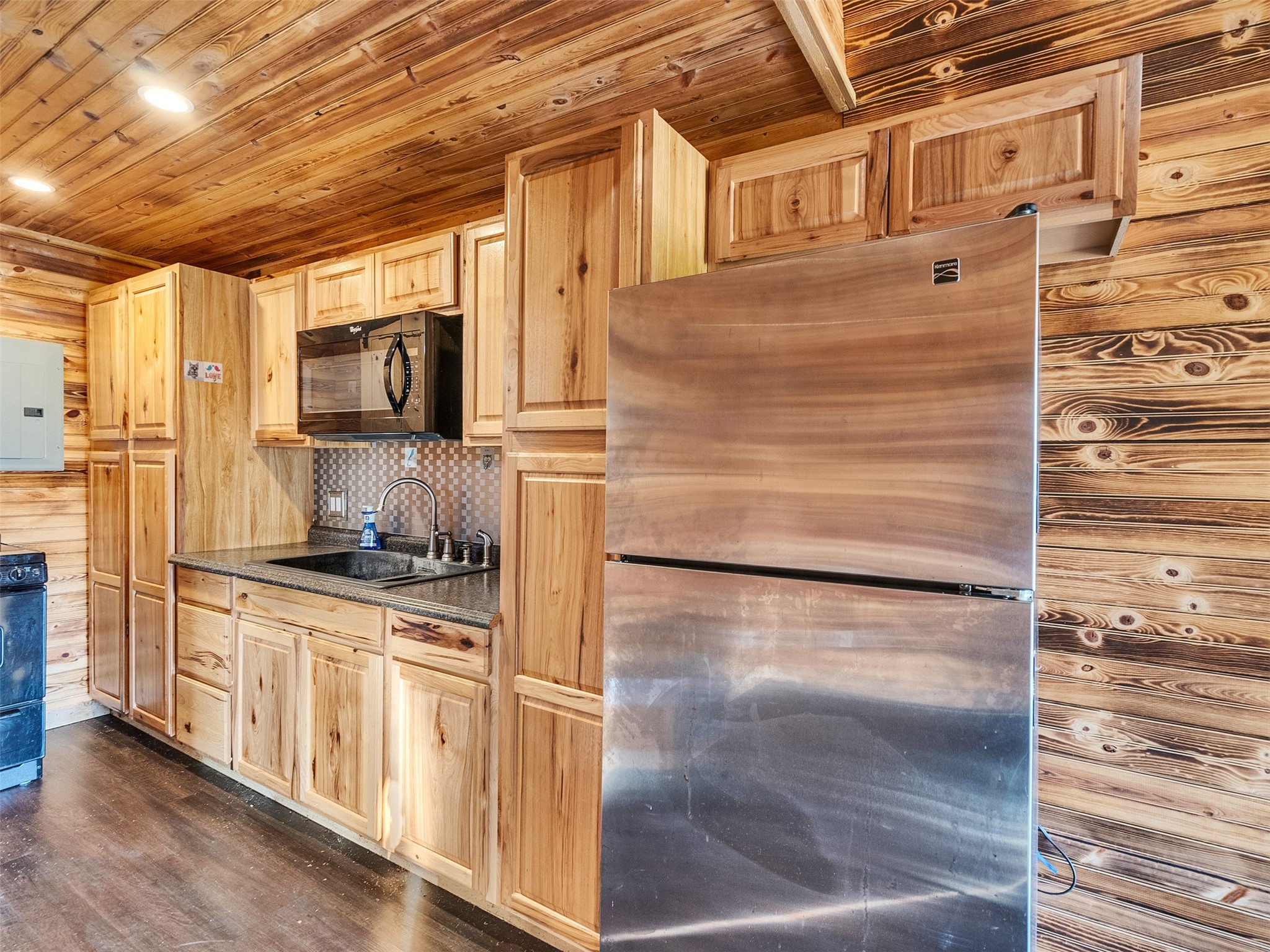 7301 Pearson Road Santa Fe, TX 77517 - Photo 32 of 46 a kitchen with stainless steel appliances a refrigerator and cabinets