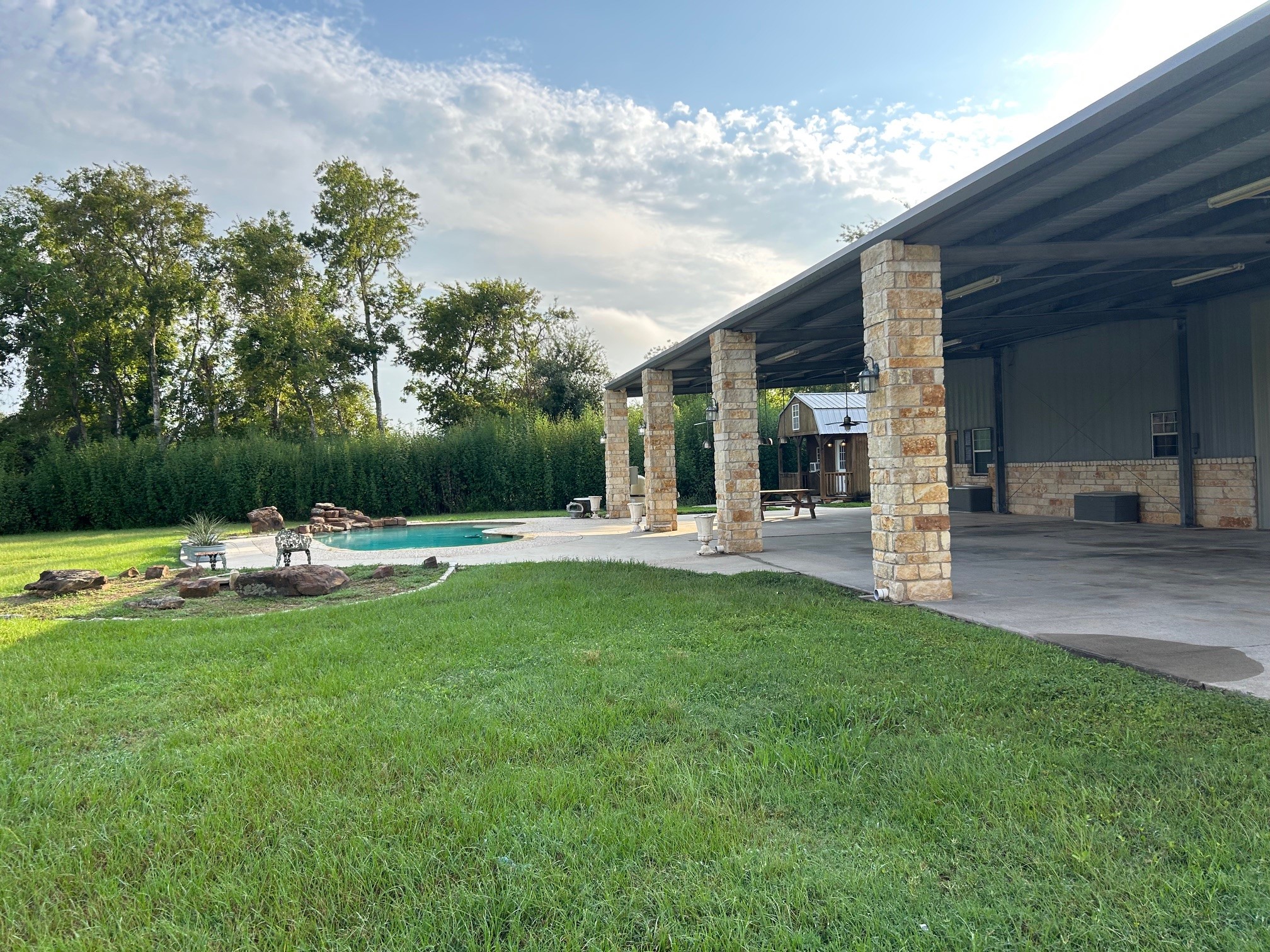 7301 Pearson Road Santa Fe, TX 77517 - Photo 46 of 46 a view of swimming pool with a bench and trees in the background