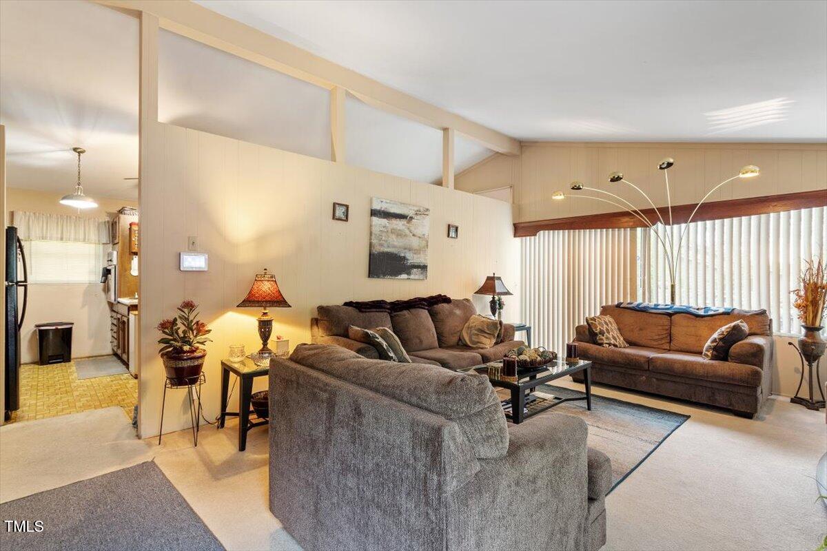 911 Williams Road Raleigh, NC 27610 - Photo 13 of 33 a living room with furniture and a large window