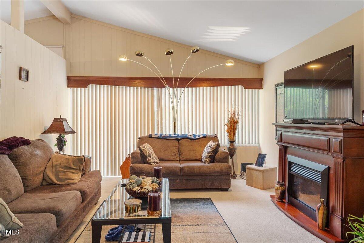 911 Williams Road Raleigh, NC 27610 - Photo 16 of 33 a living room with furniture and a fireplace