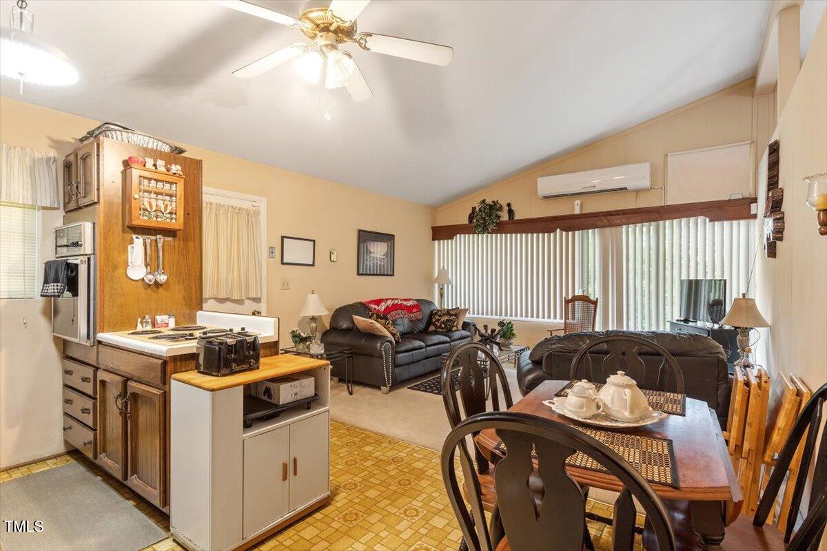 911 Williams Road Raleigh, NC 27610 - Photo 18 of 33 a living room with furniture and a large window
