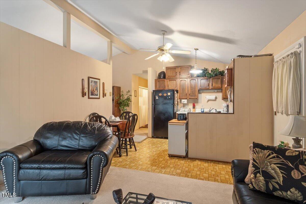911 Williams Road Raleigh, NC 27610 - Photo 20 of 33 a living room with furniture and kitchen view