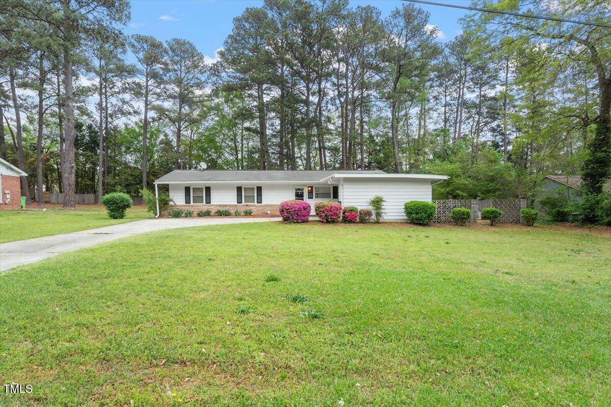 911 Williams Road Raleigh, NC 27610 - Photo 2 of 33 a front view of house with yard and trees in the background