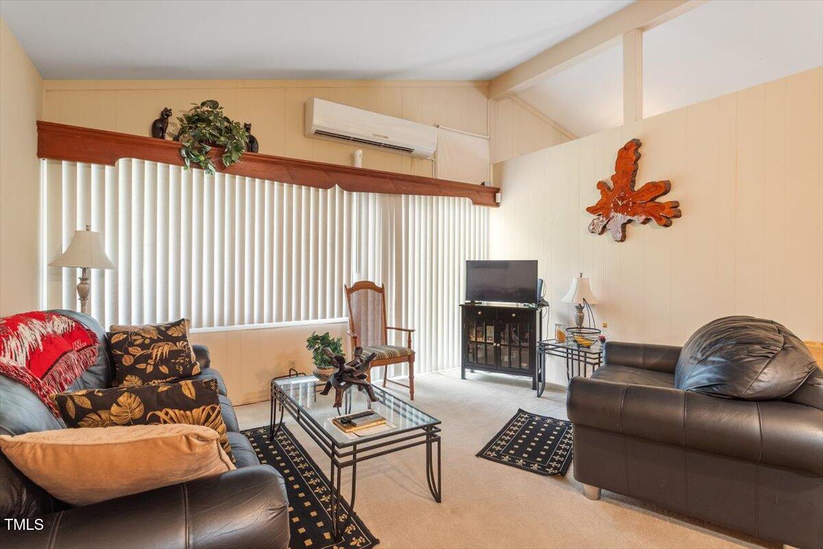 911 Williams Road Raleigh, NC 27610 - Photo 21 of 33 a living room with furniture and a fireplace
