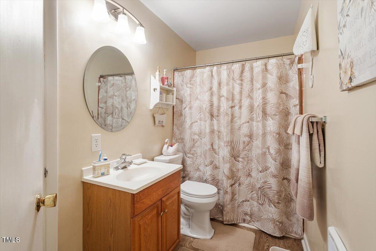 911 Williams Road Raleigh, NC 27610 - Photo 25 of 33 a bathroom with a sink toilet and shower