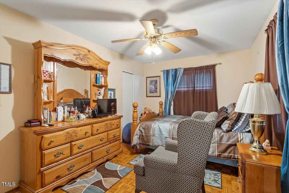 911 Williams Road Raleigh, NC 27610 - Photo 29 of 33 a bed room with a bed and a mirror