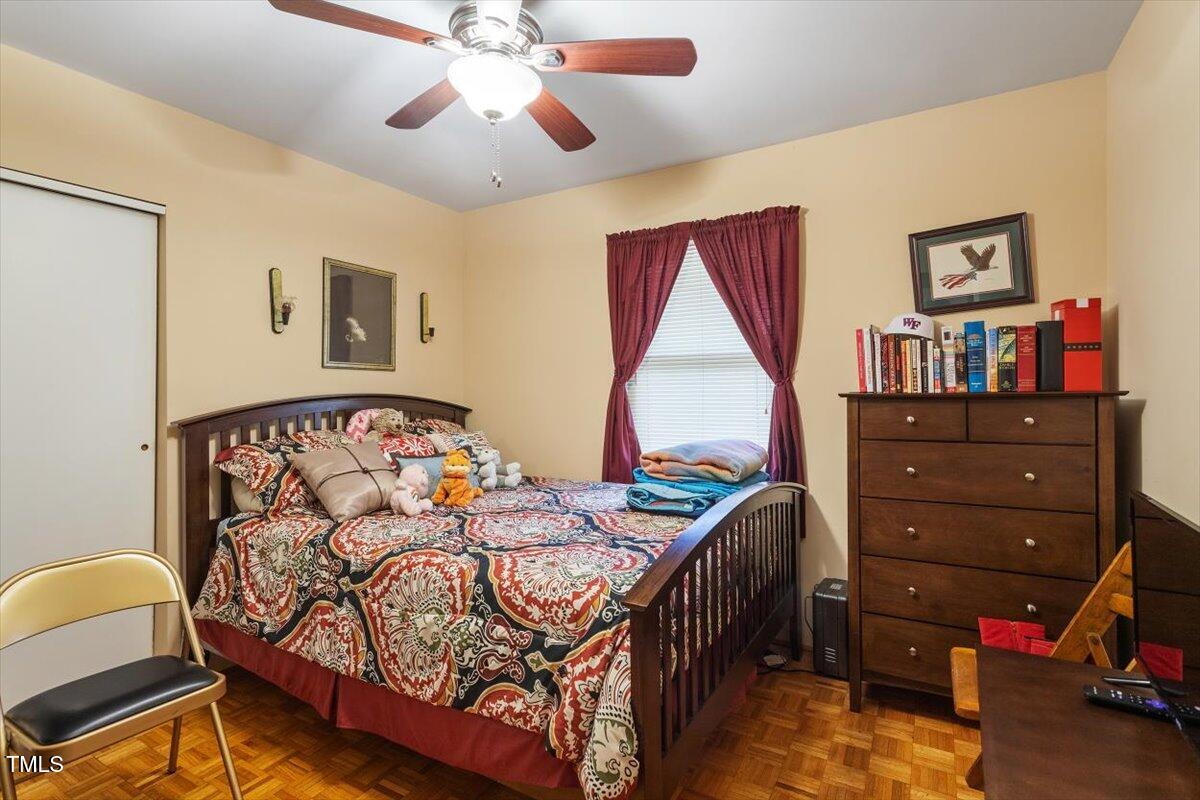 911 Williams Road Raleigh, NC 27610 - Photo 33 of 33 a bedroom with a bed closet and a window
