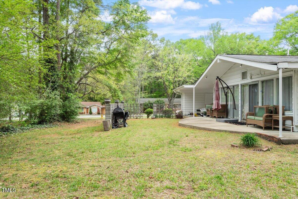 911 Williams Road Raleigh, NC 27610 - Photo 10 of 33 a view of a house with swimming pool and sitting area