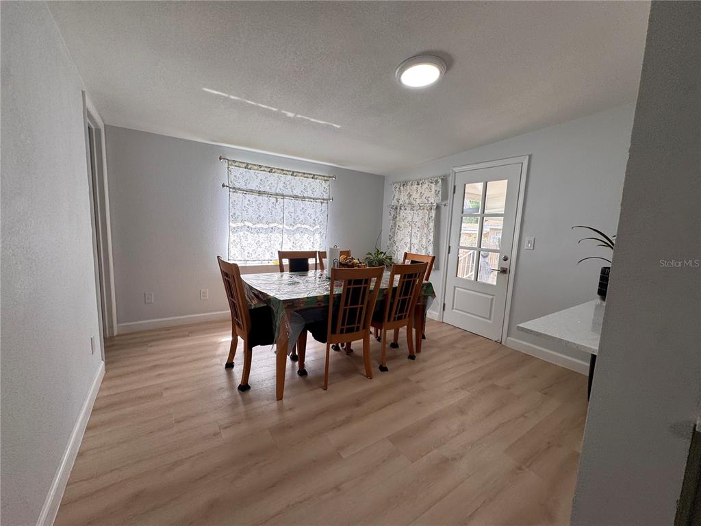 125 Ridgewood Drive Arcadia, FL 34266 - Photo 12 of 31 a view of a a dining room with furniture window and wooden floor