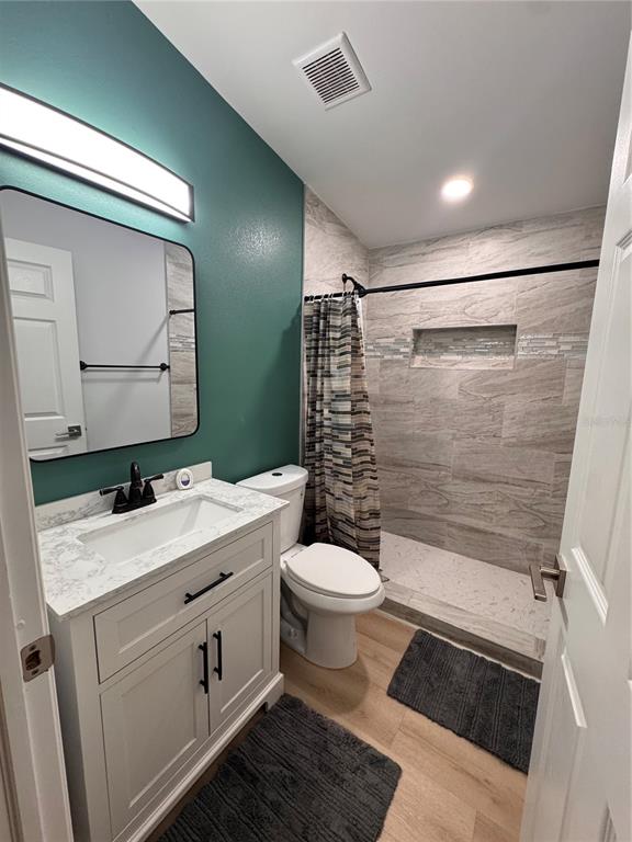 125 Ridgewood Drive Arcadia, FL 34266 - Photo 17 of 31 a bathroom with a sink toilet and shower