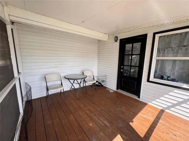 a view of livingroom with furniture and front door
