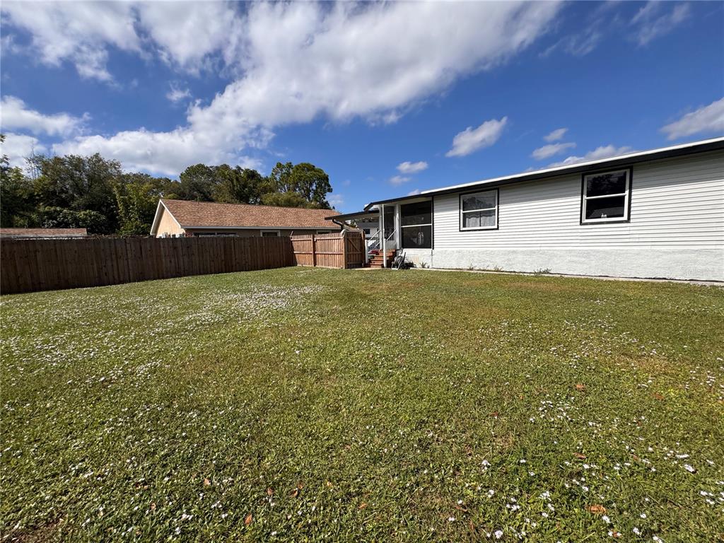 125 Ridgewood Drive Arcadia, FL 34266 - Photo 31 of 31 a backyard of a house with lots of green space