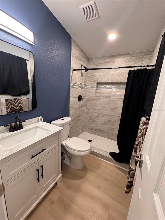 125 Ridgewood Drive Arcadia, FL 34266 - Photo 7 of 31 a bathroom with a sink a toilet and shower