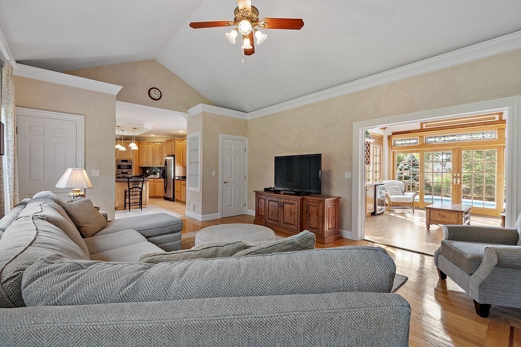 106 Fox Run Road Bolton, MA 01740 - Photo 11 of 41 a living room with furniture and a flat screen tv