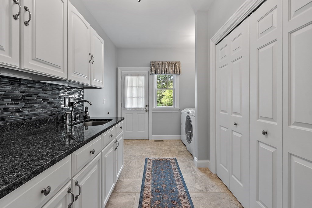 106 Fox Run Road Bolton, MA 01740 - Photo 20 of 41 a large white kitchen with granite countertop a sink