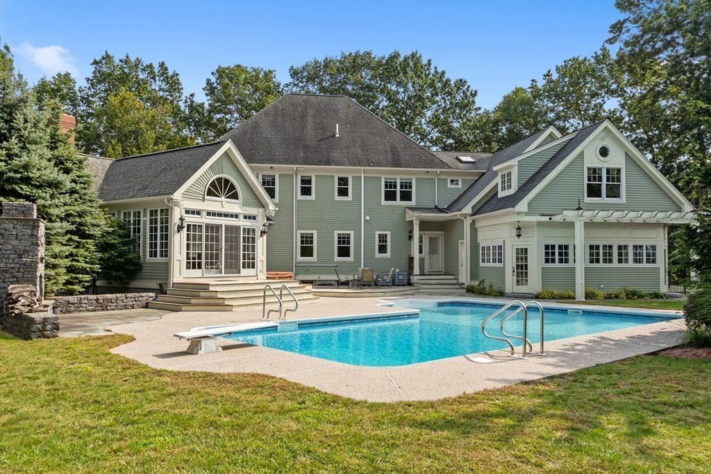 106 Fox Run Road Bolton, MA 01740 - Photo 2 of 41 a view of a house with swimming pool and porch with furniture