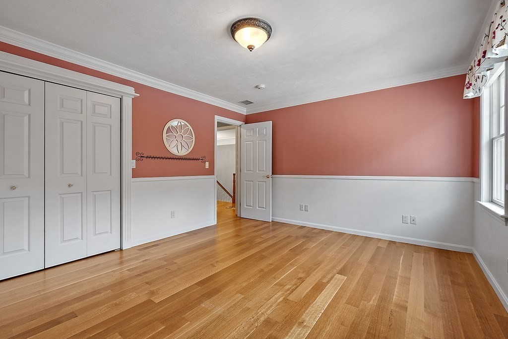 106 Fox Run Road Bolton, MA 01740 - Photo 30 of 41 a view of a hallway with wooden floor