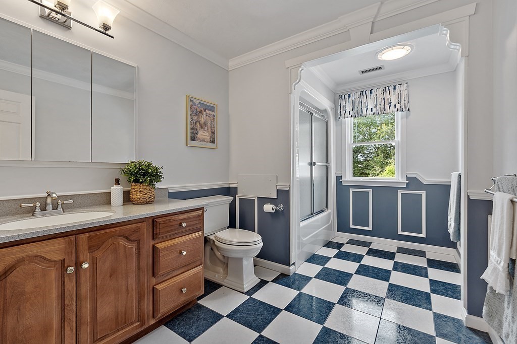 106 Fox Run Road Bolton, MA 01740 - Photo 33 of 41 a bathroom with a sink toilet a mirror and shower