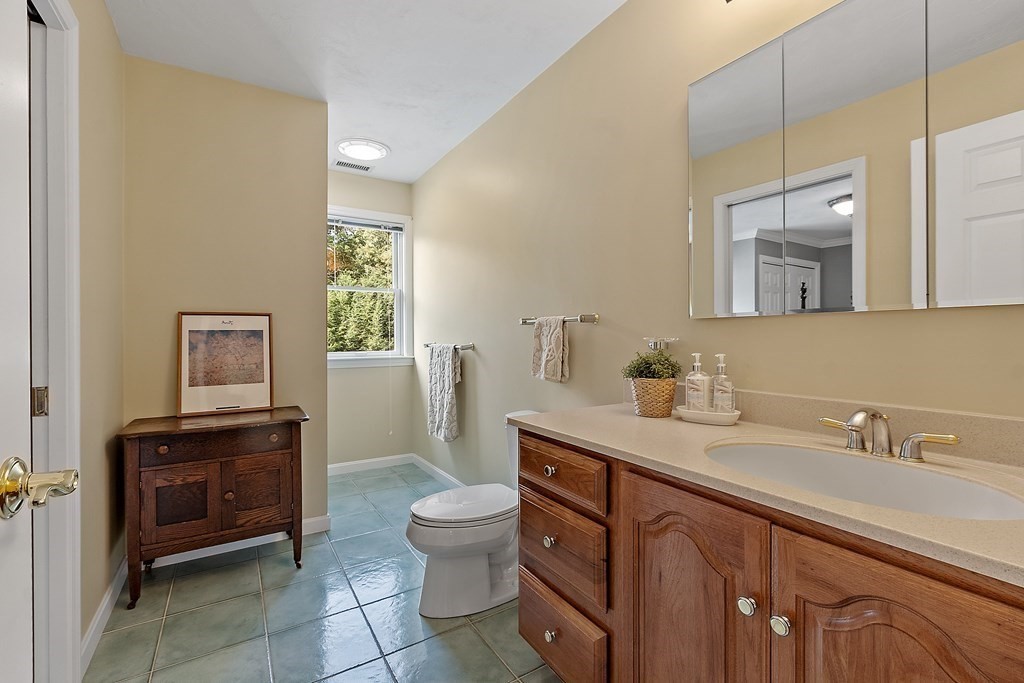 106 Fox Run Road Bolton, MA 01740 - Photo 34 of 41 a spacious bathroom with a sink a toilet and a mirror