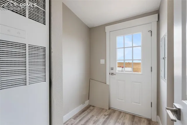 a spacious bedroom with a bed and a chandelier