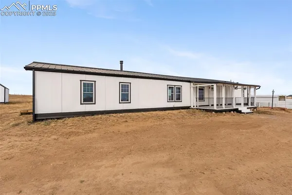 a house with swimming pool in front of it