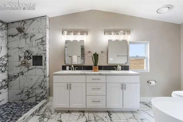 a bathroom with a shower and a sink