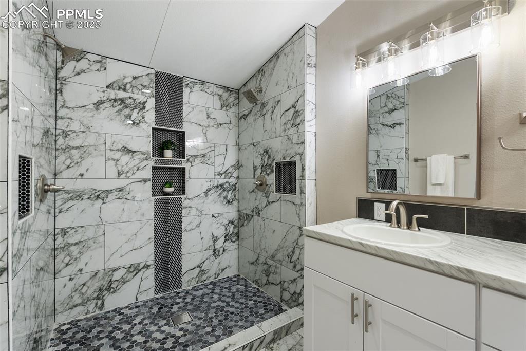 6190 Night Train Lane Yoder, CO 80864 - Photo 23 of 35 a bathroom with a shower and a sink