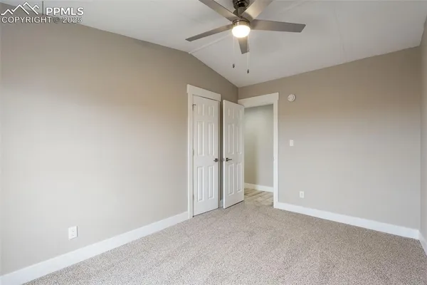 a room with gym equipment and windows