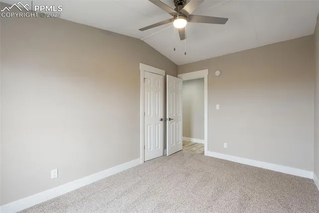 a room with gym equipment and windows
