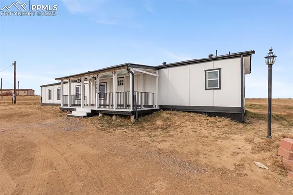 a view of an house with backyard space
