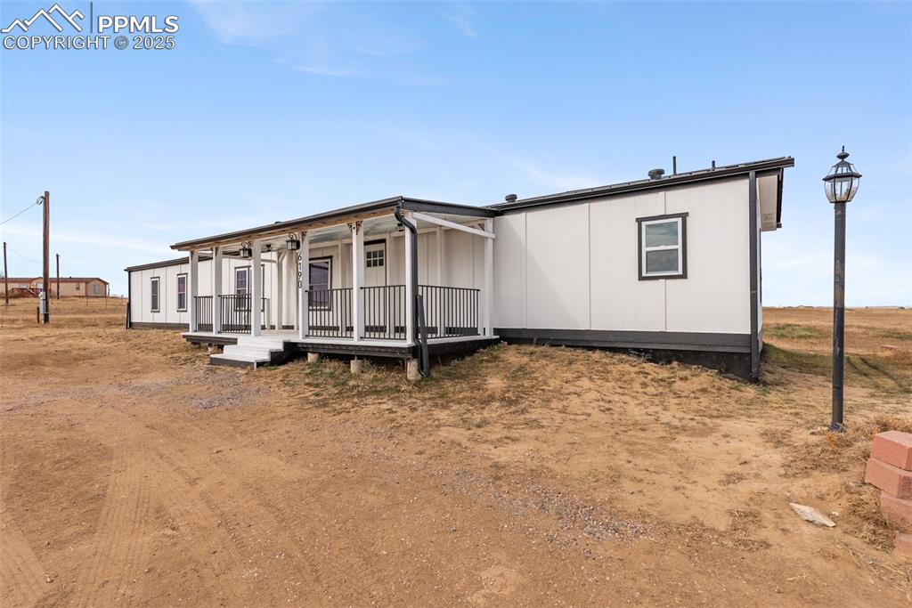 6190 Night Train Lane Yoder, CO 80864 - Photo 3 of 35 a view of an house with backyard space
