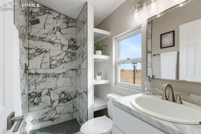 a view of a house with wooden fence